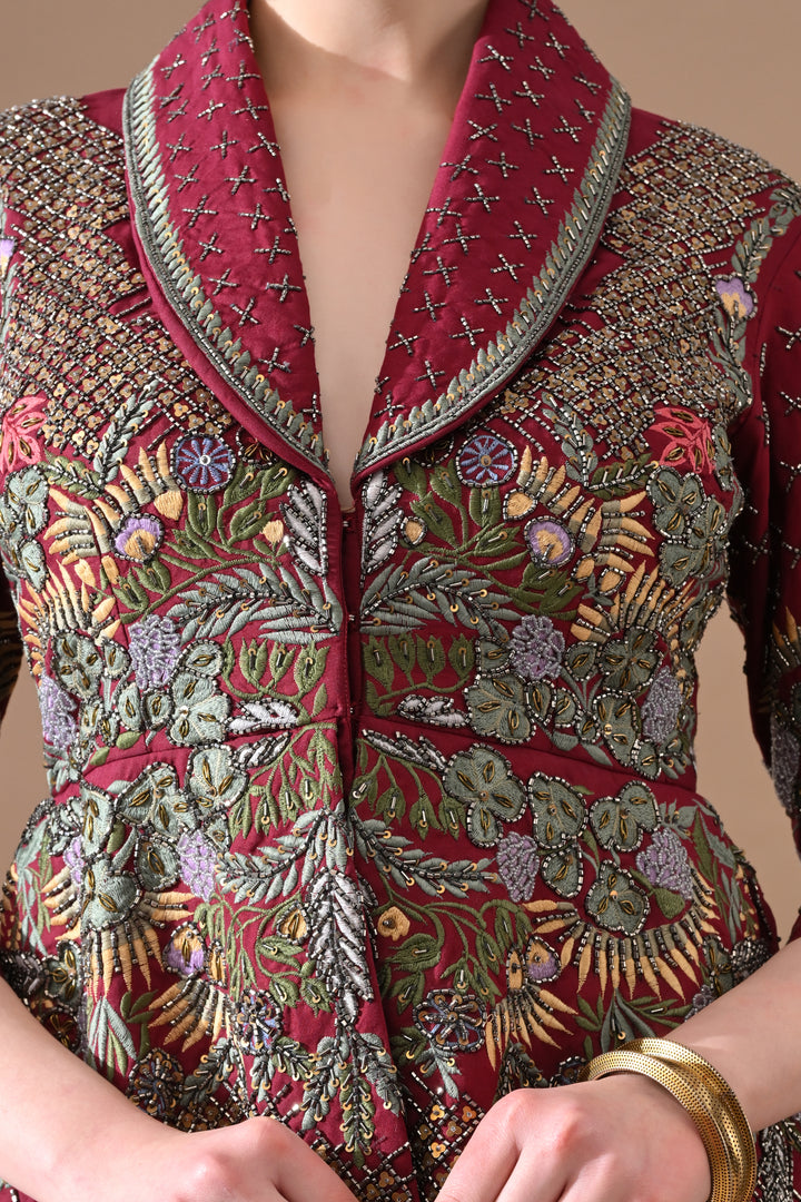 A Maroon Jacket Features Intricate All-Over Embroidery With Skirt