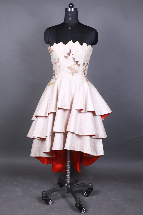 White dress on a mannequin against a gray background