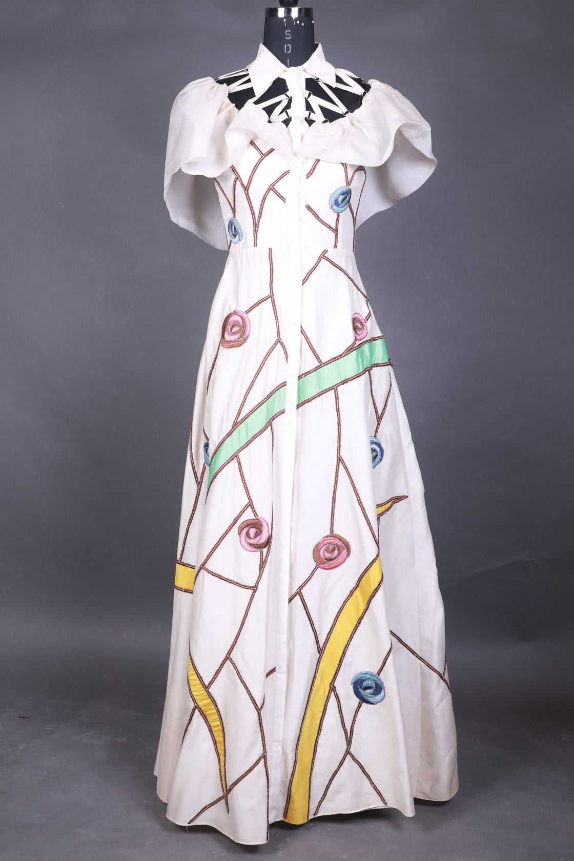 Colorful dress form on a gray background