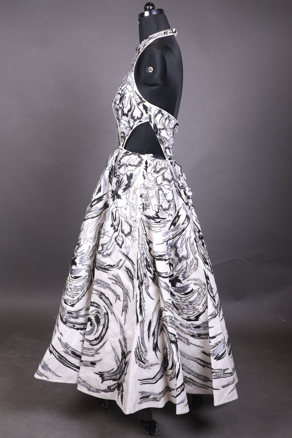 Black and white patterned dress on a mannequin against a dark background