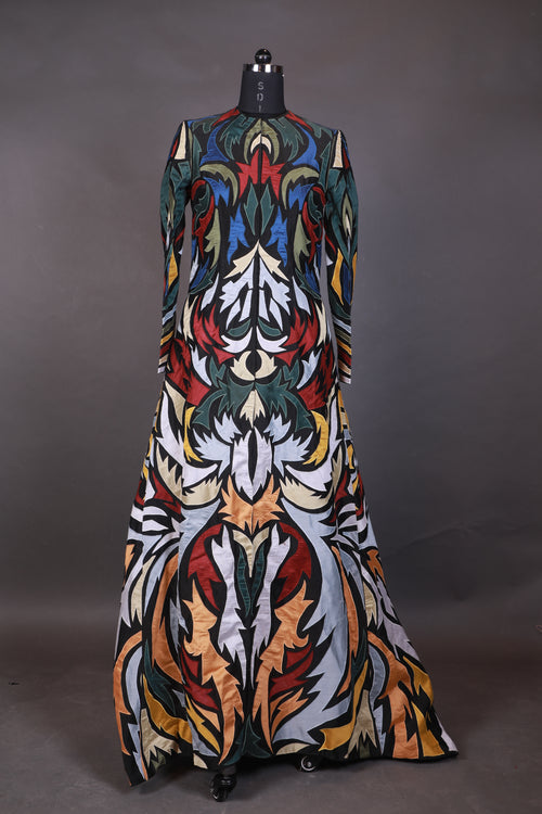 Hooded, floor length cotton silk gown, surfaced with colorful appliqué work all over.
