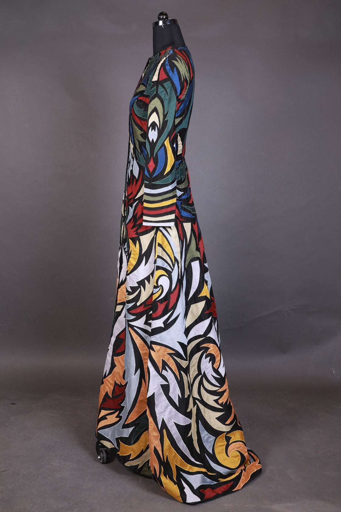 Hooded, floor length cotton silk gown, surfaced with colorful appliqué work all over.
