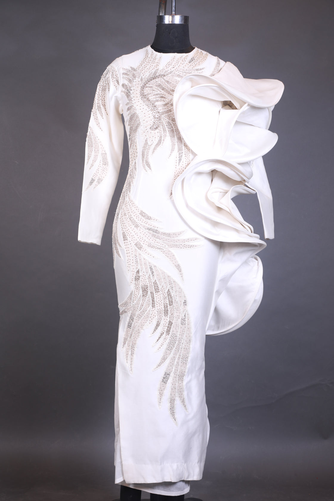 White embroidered glove on a black background