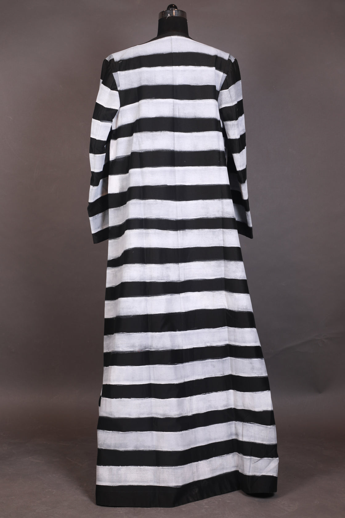 A black cotton silk floor-length jacket with block printed along with embraided neck inner