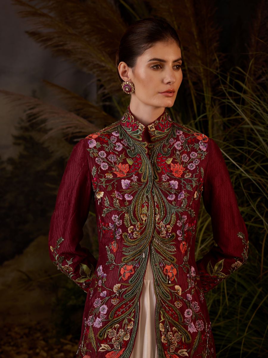 A maroon cotton silk jacket with floor length ruffle dress off-shoulder neck line