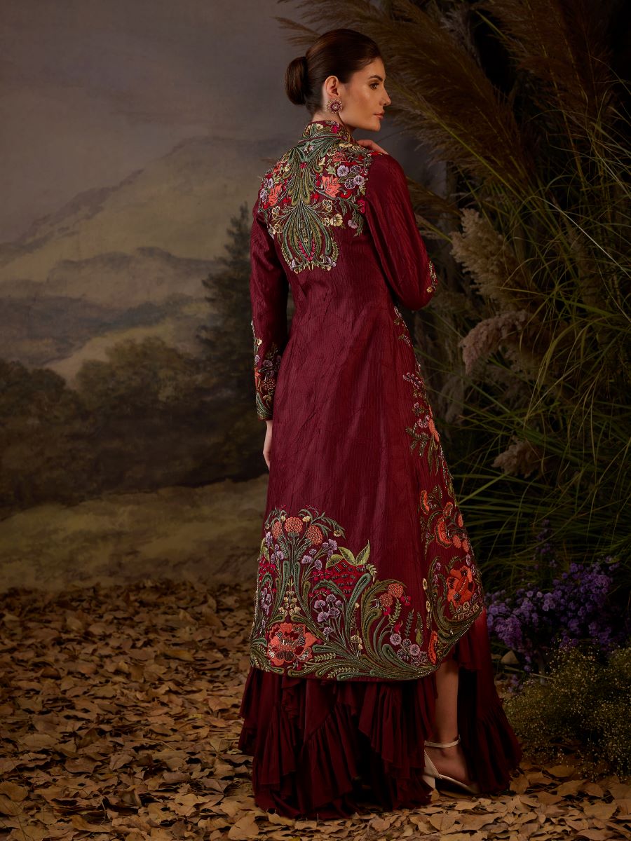 A maroon cotton silk jacket with floor length ruffle dress off-shoulder neck line