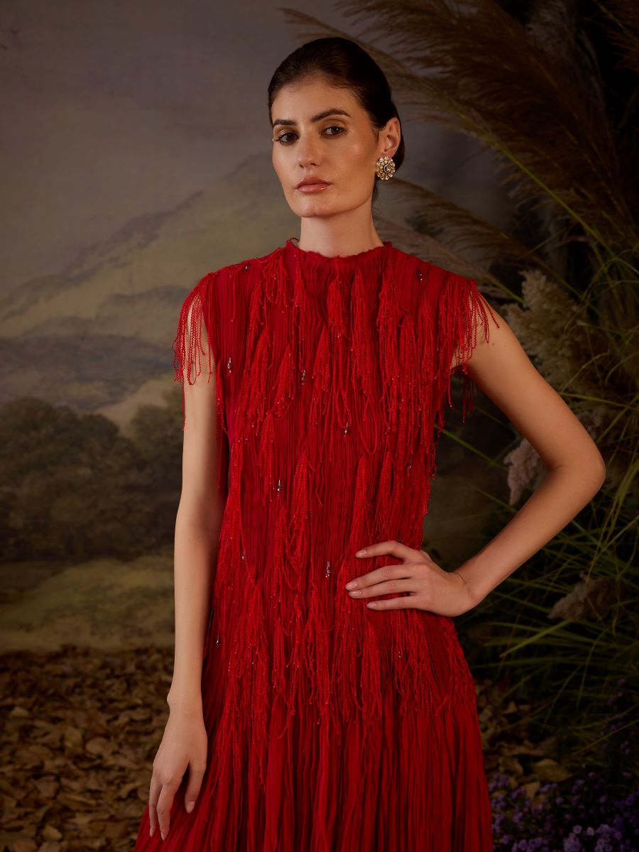 A red cotton silk pleated gown with lace embroidery