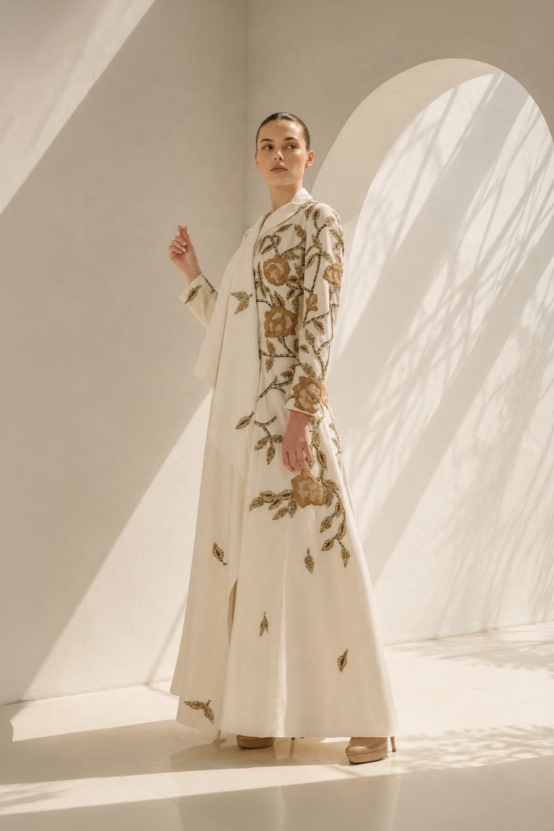 Ivory Gown With Cape-Like Elegance