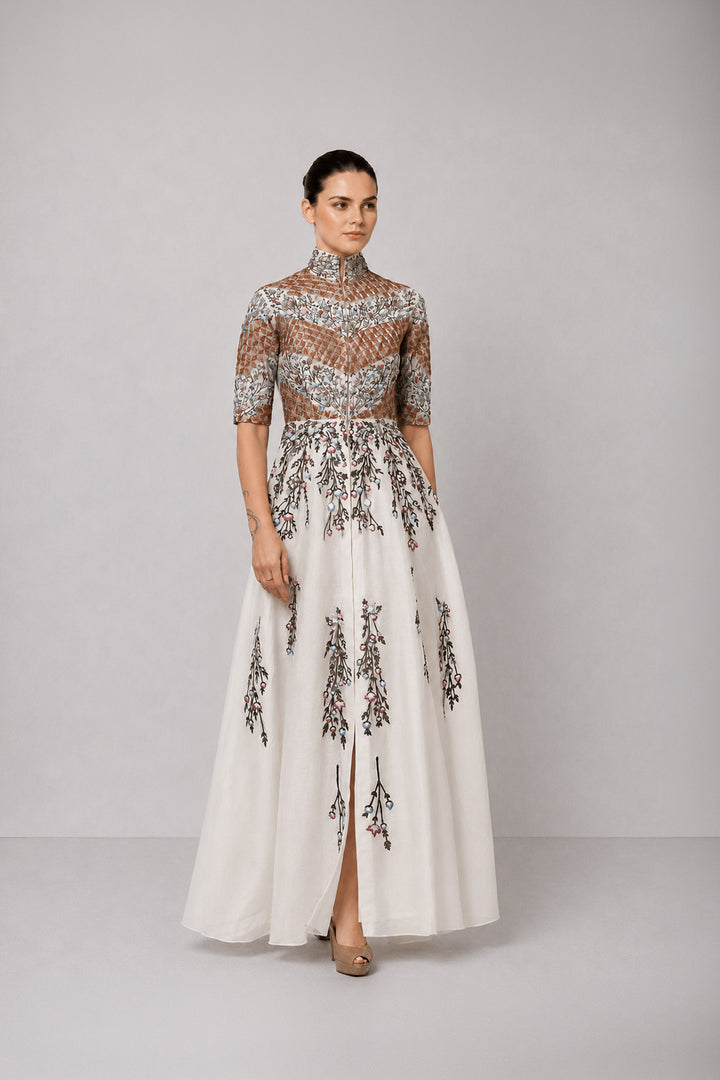 Ivory Embroidered Gown With Structured High Neck And Cascading Floral Motifs.
