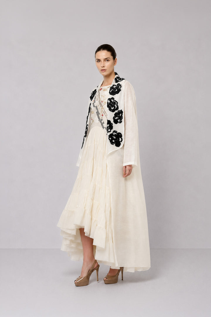Ivory Tiered Dress With Floral Embroidered Bodice And Statement Applique Jacket.