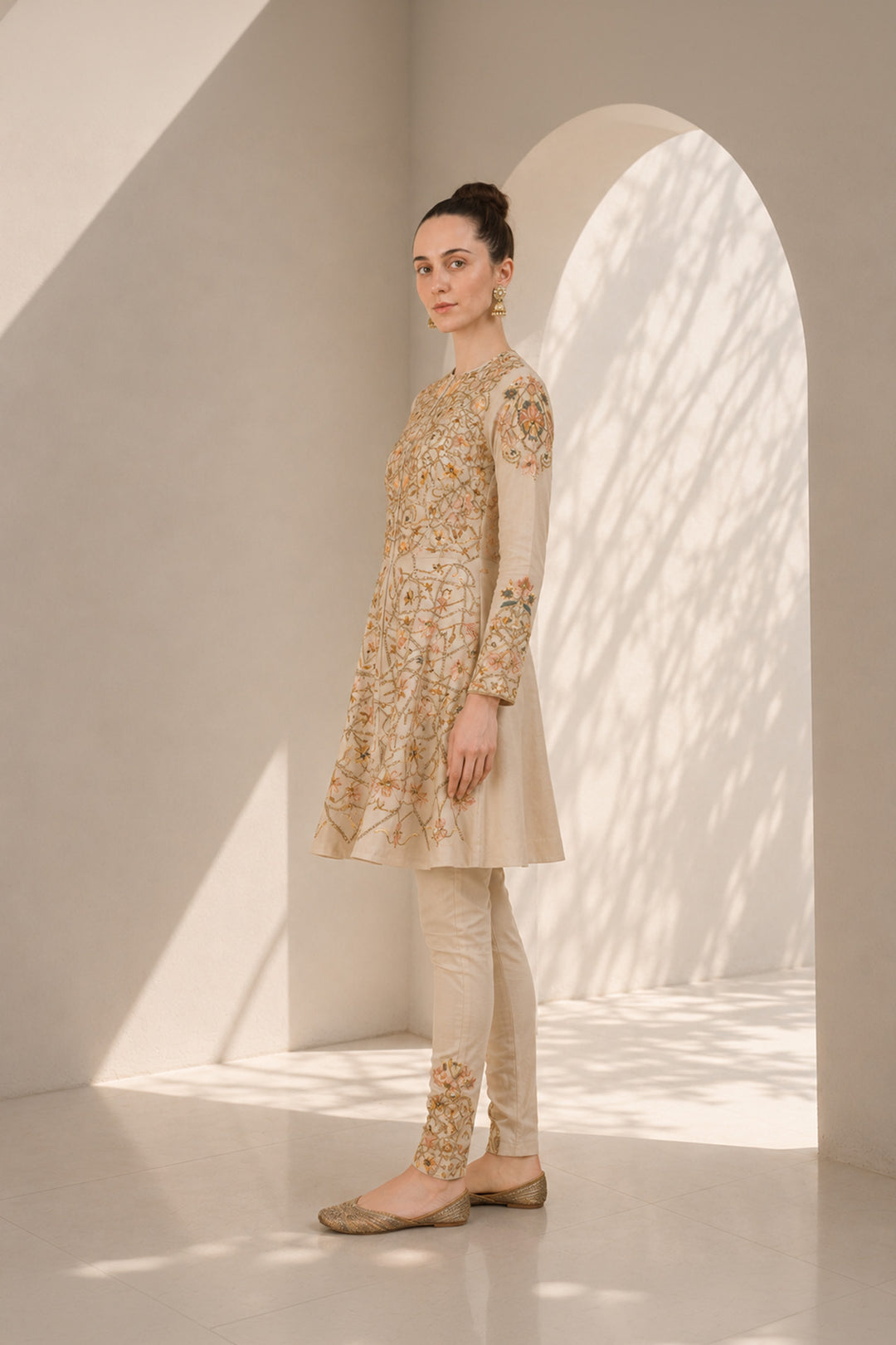 Ivory embroidered kurta set featuring a flattering fit-and-flare silhouette and refined artisanal detailing.