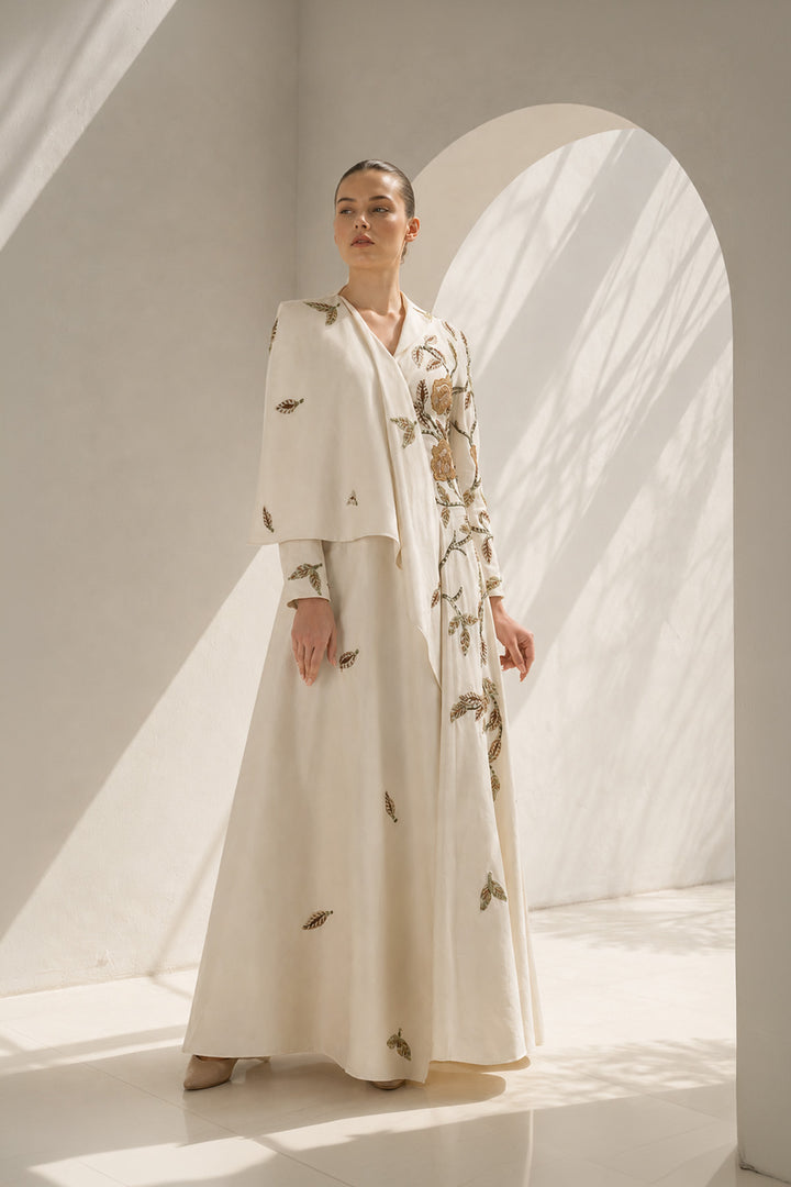 Ivory Gown With Cape-Like Elegance