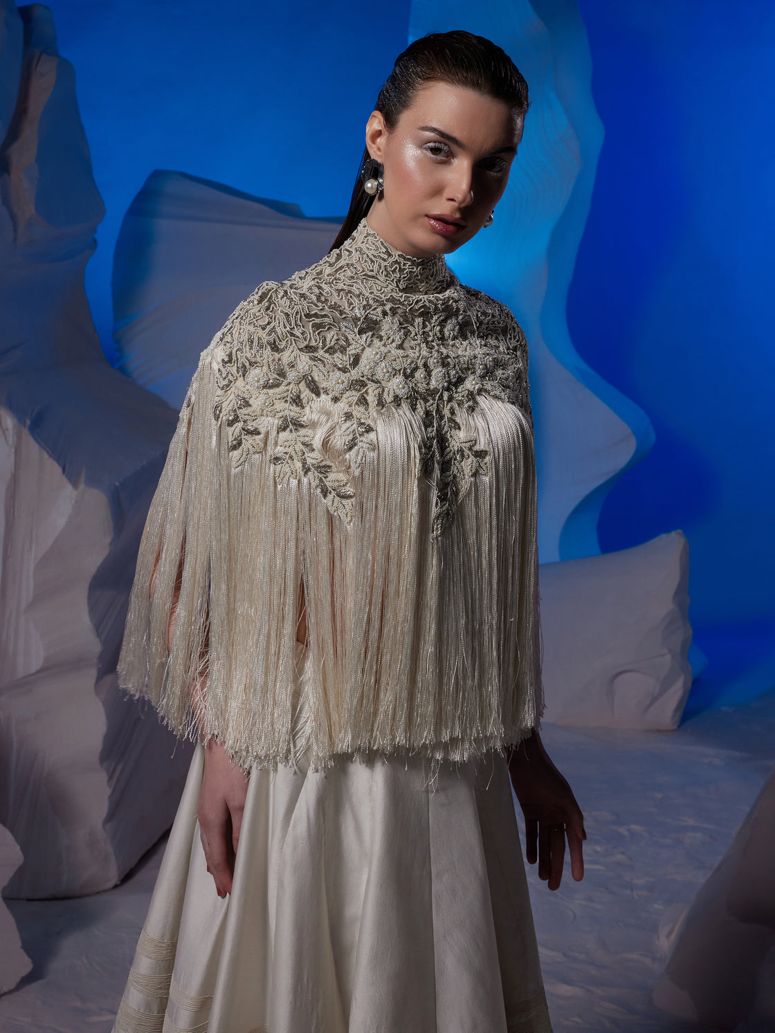 Chic ivory top adorned by silver and pearl embroidery