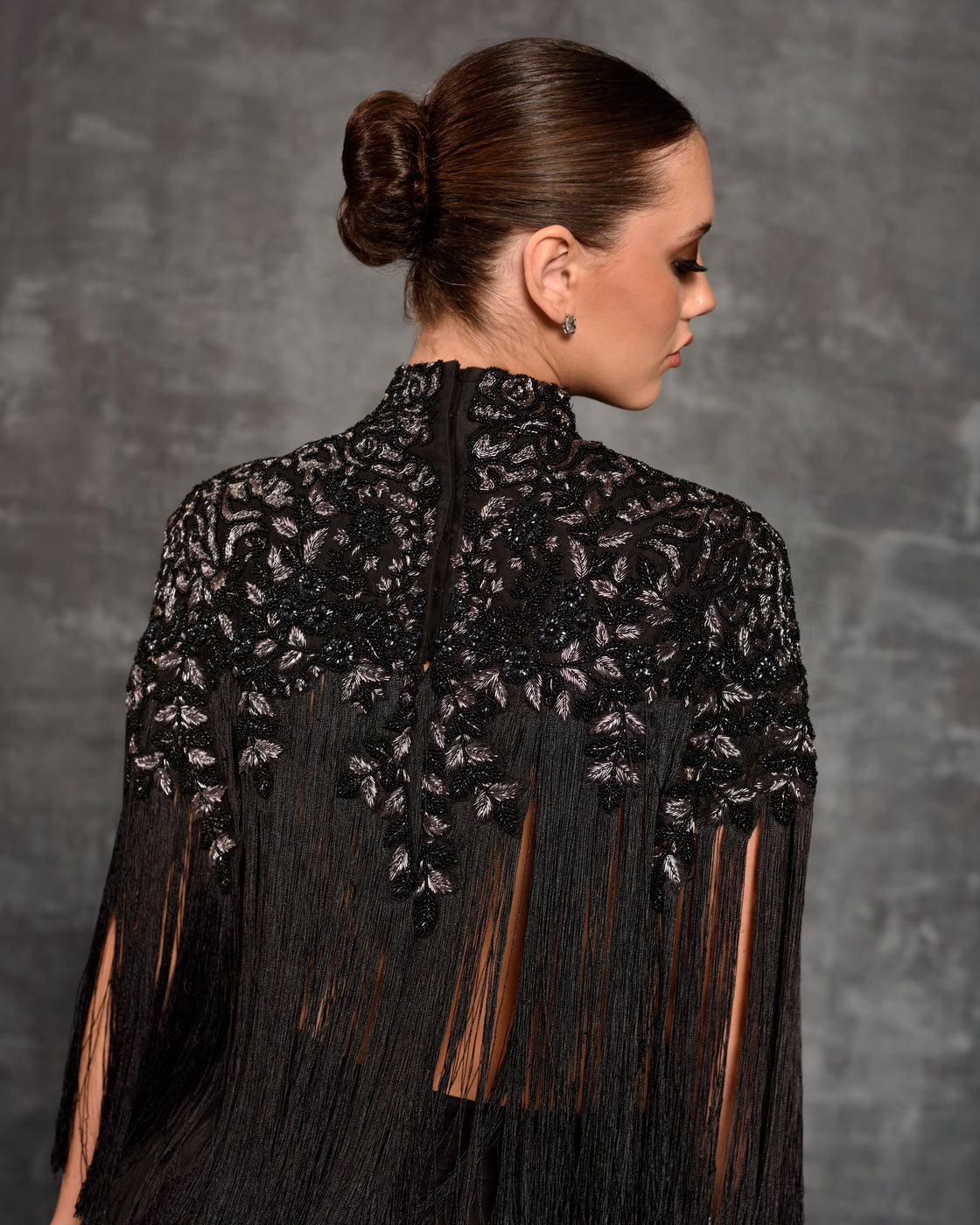 Chic black top adorned by silver and pearl embroidery