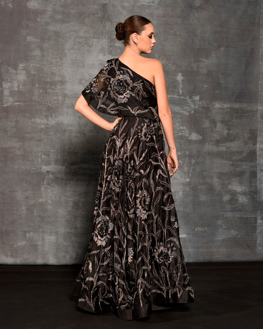 One-shoulder gown enhanced with glass bead embroidery