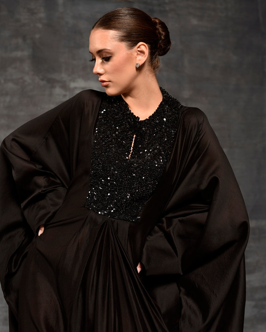 Black kaftan featuring loaded sequence work at front