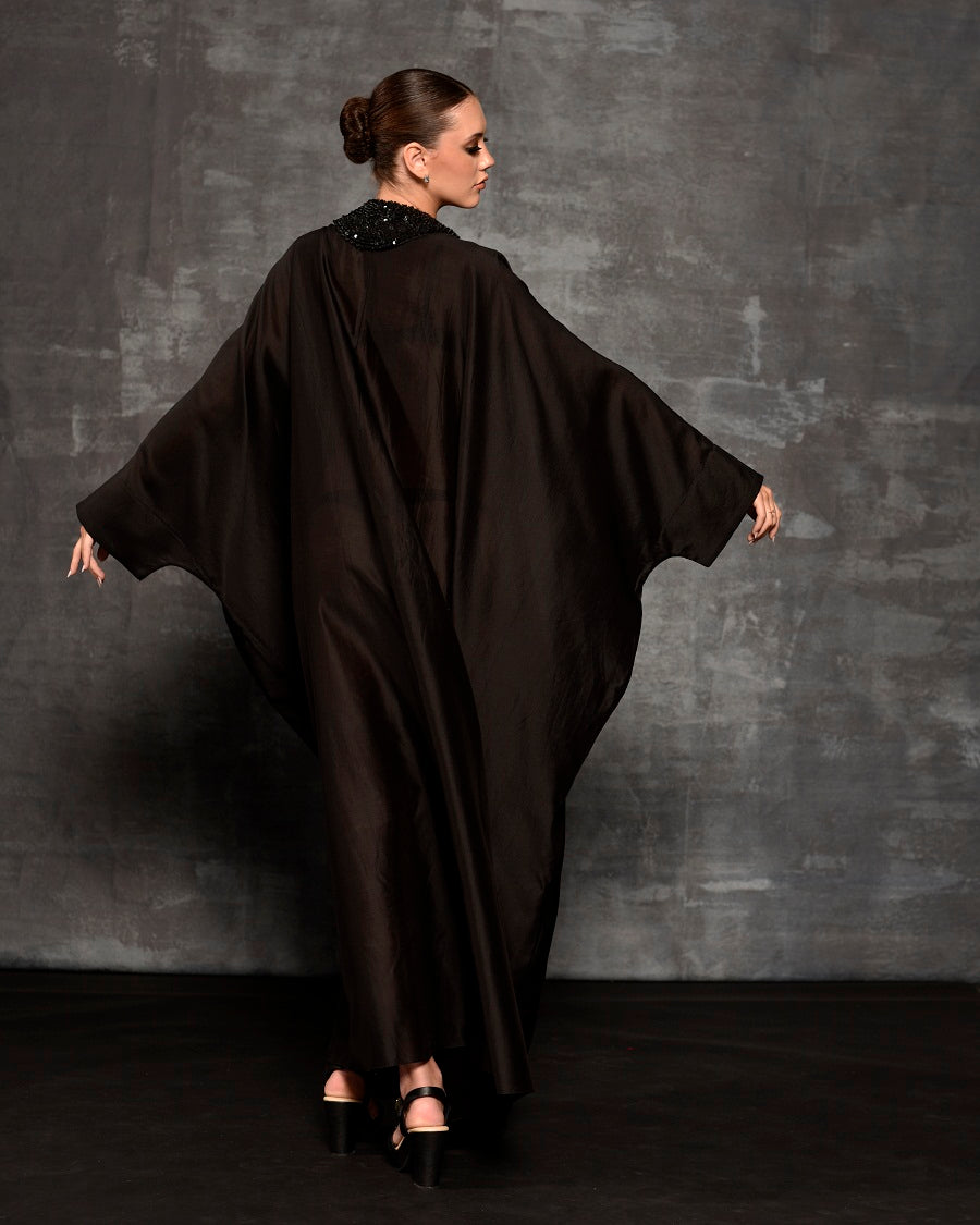 Black kaftan featuring loaded sequence work at front