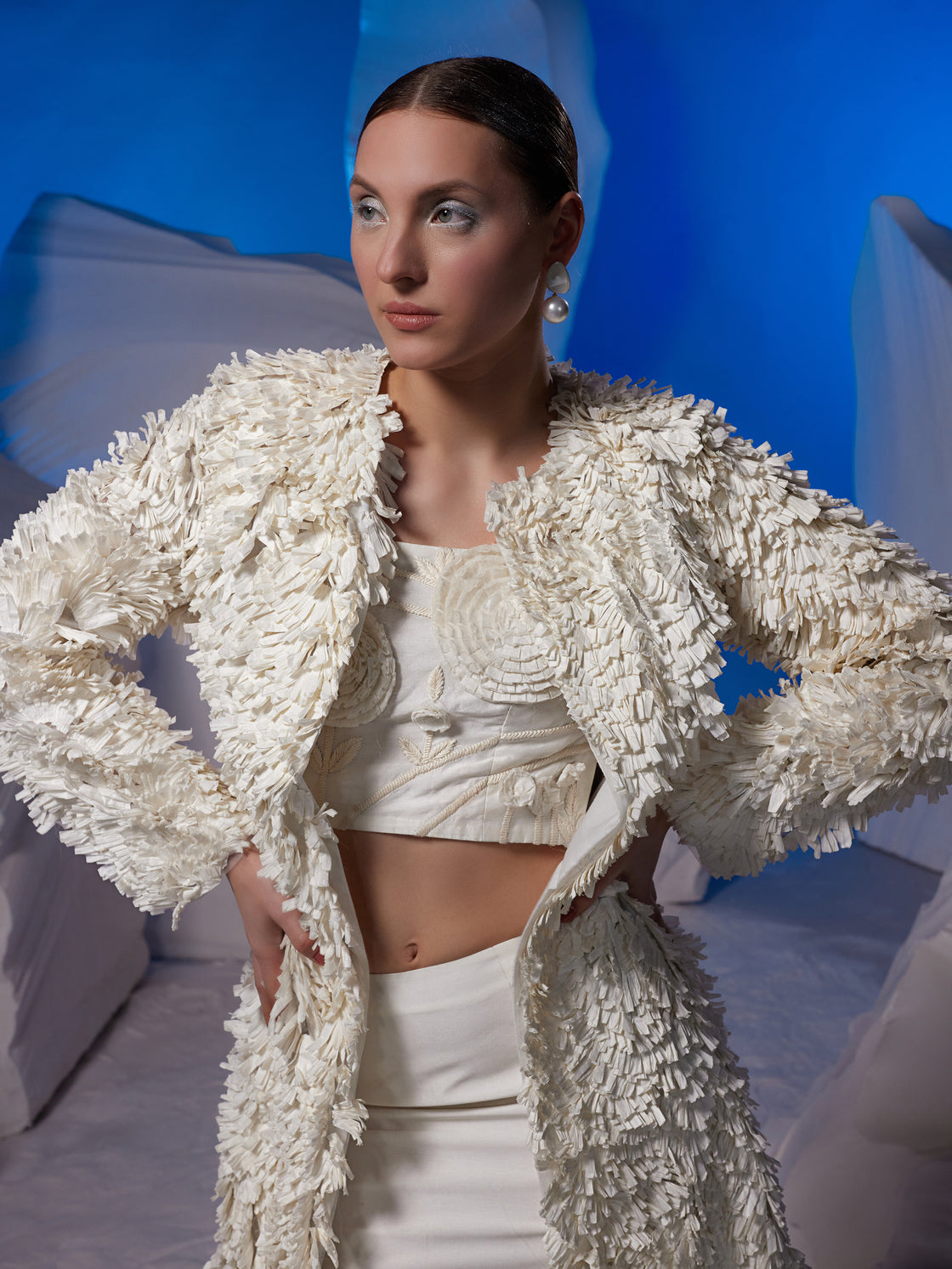 Textured ivory jacket with chic top and skirt