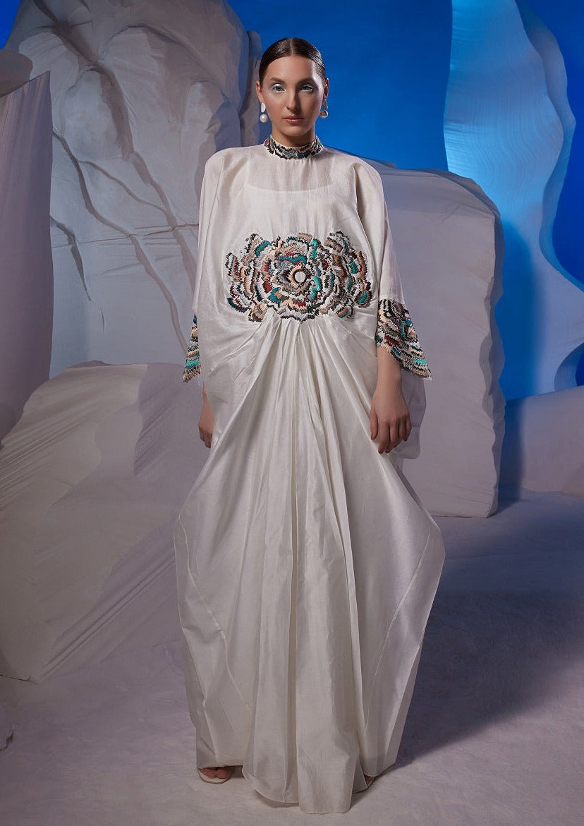 Cowl dress adorned with vibrant embroidery