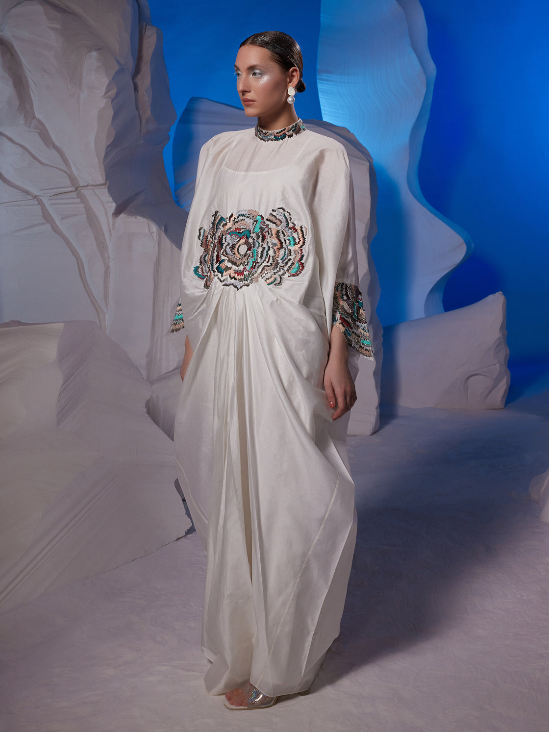 Cowl dress adorned with vibrant embroidery
