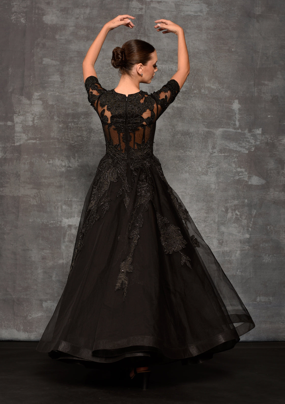 Black net fabric sheer ball gown enhanced with applique work