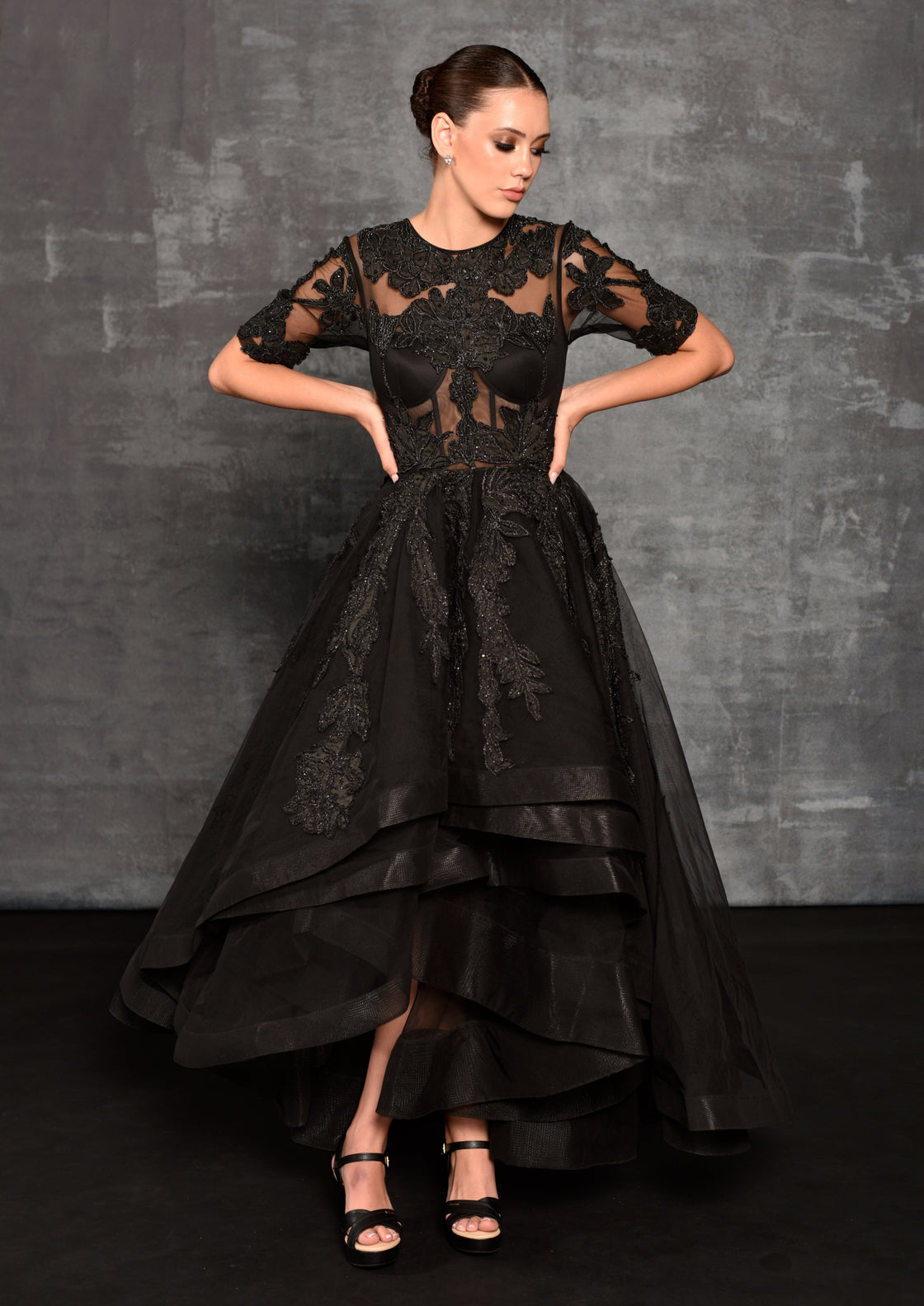 Black net fabric sheer ball gown enhanced with applique work