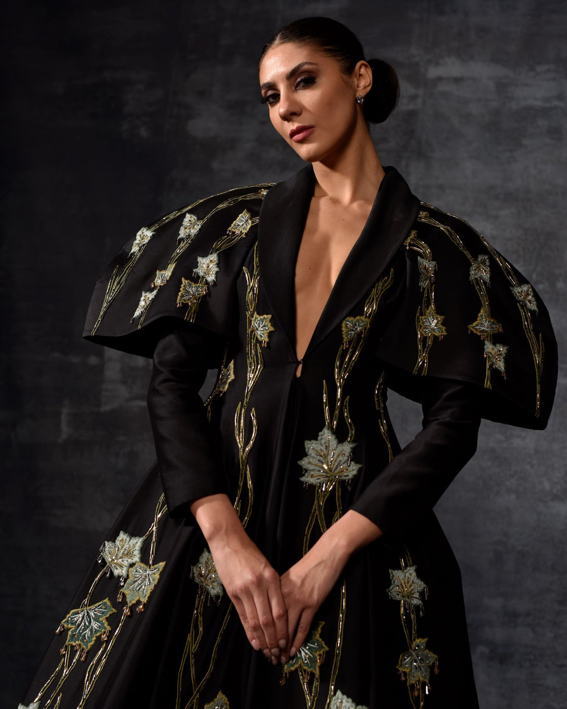 A black cotton silk  fabric floor length gown with lapel neck line