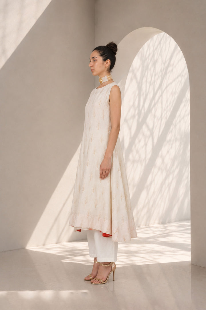 Ivory kurta set adorned with delicate motifs, elegant notch neckline, straight silhouette with a relaxed fit paired with wide-leg trousers.