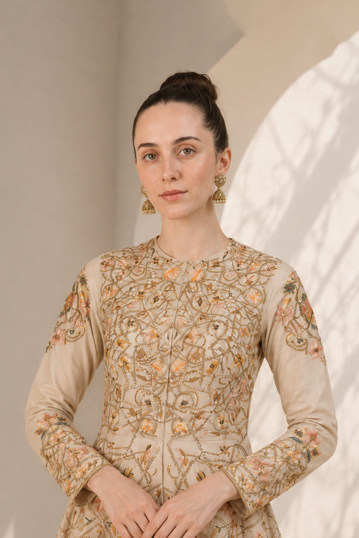 Ivory embroidered kurta set featuring a flattering fit-and-flare silhouette and refined artisanal detailing.