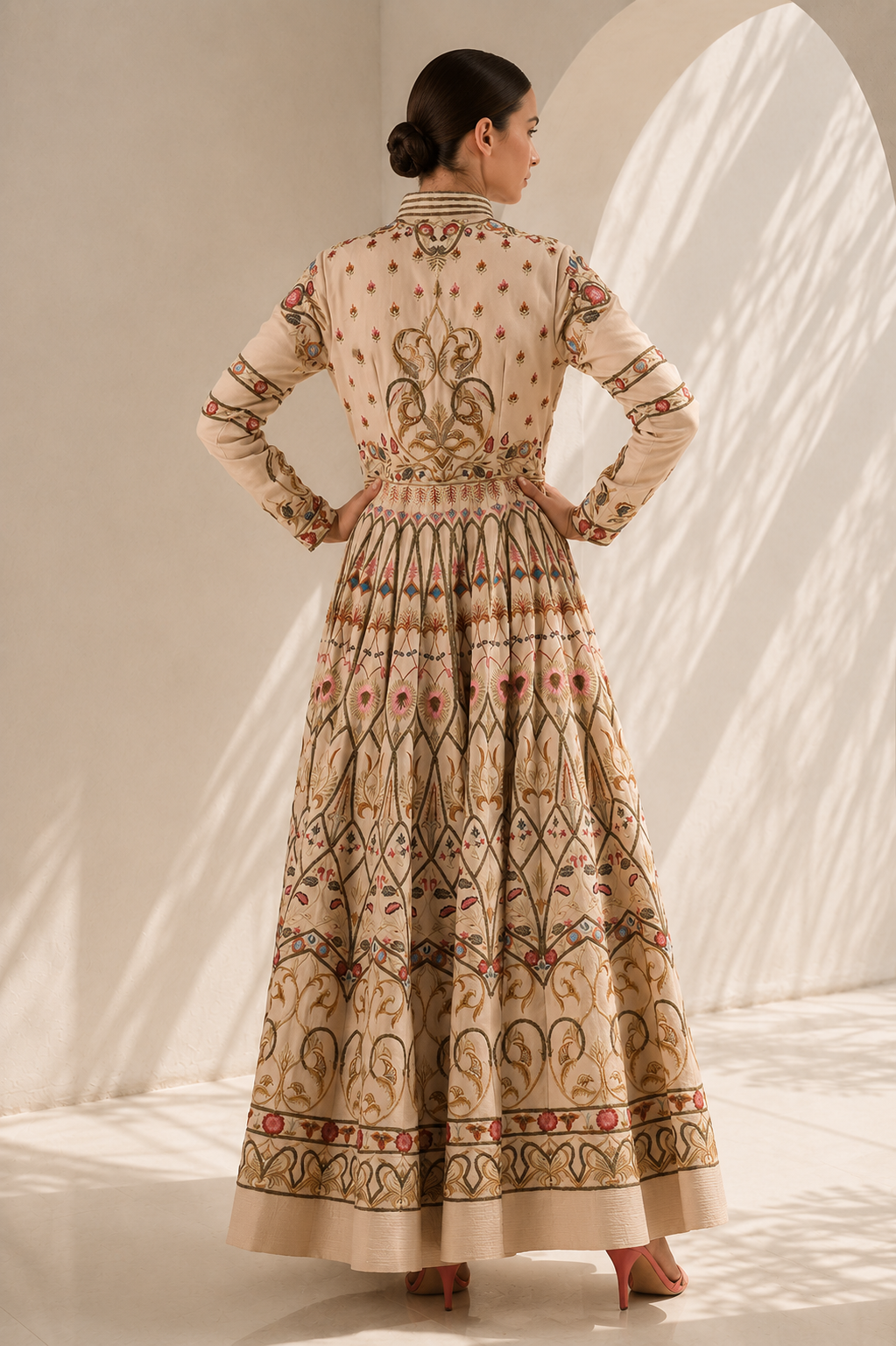 Ivory embroidered gown featuring a regal mandarin collar, full-length sleeves, fitted bodice with a voluminous flared silhouette.