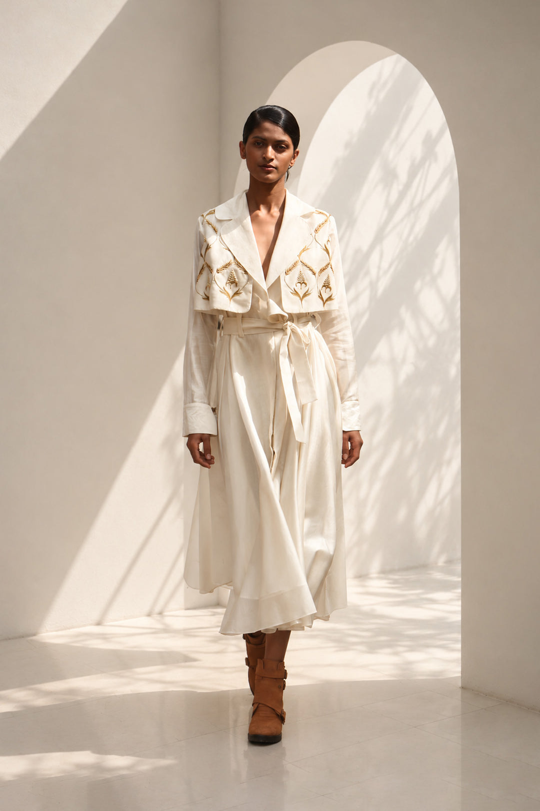 Ivory wrap dress featuring delicate embroidery, sheer sleeves and fluid drape.