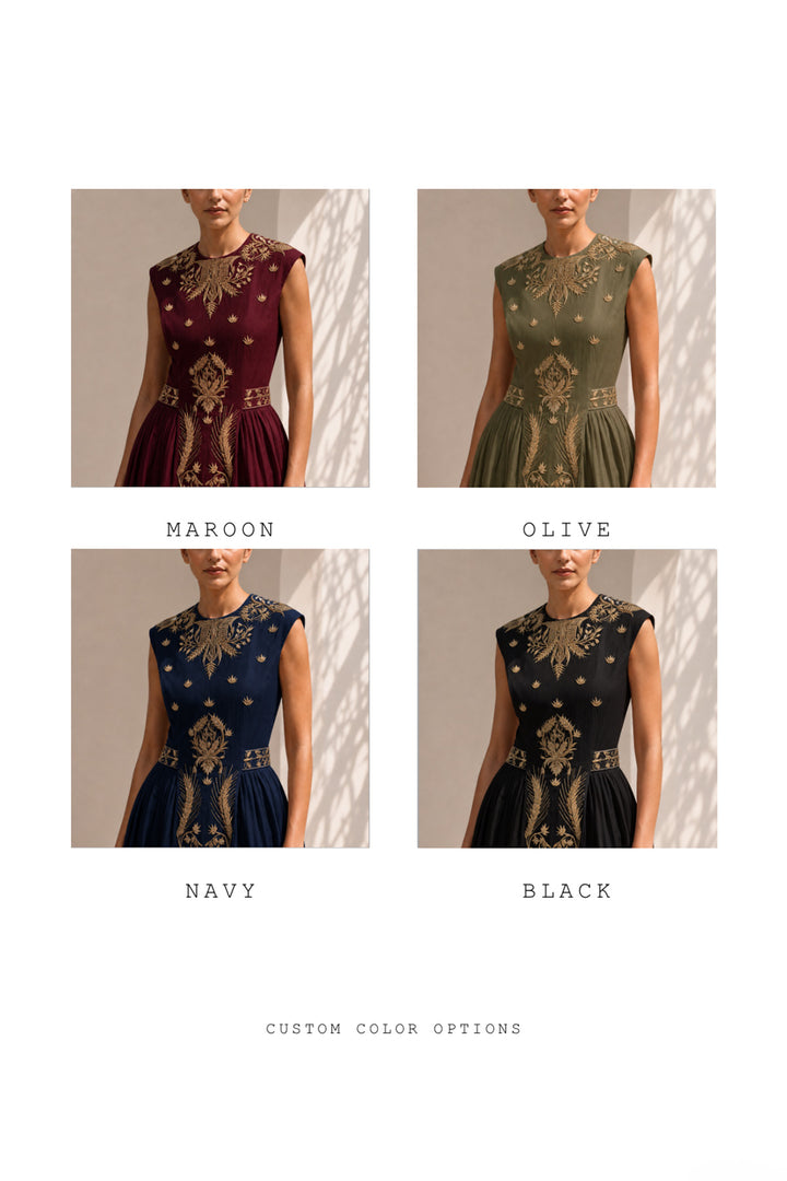 lvory midi dress adorned with embroidery, delicate pleated accents, blending structured elegance with fluid femininity.