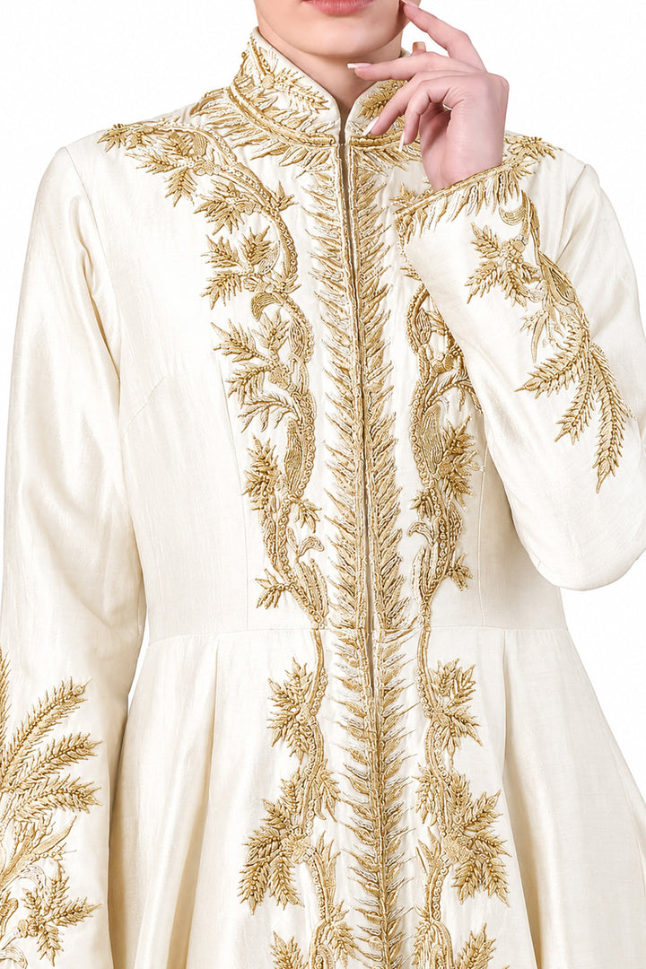 Ivory floor-length gown adorned with full-length sleeves and intricate gold-toned palm-inspired embroidery.