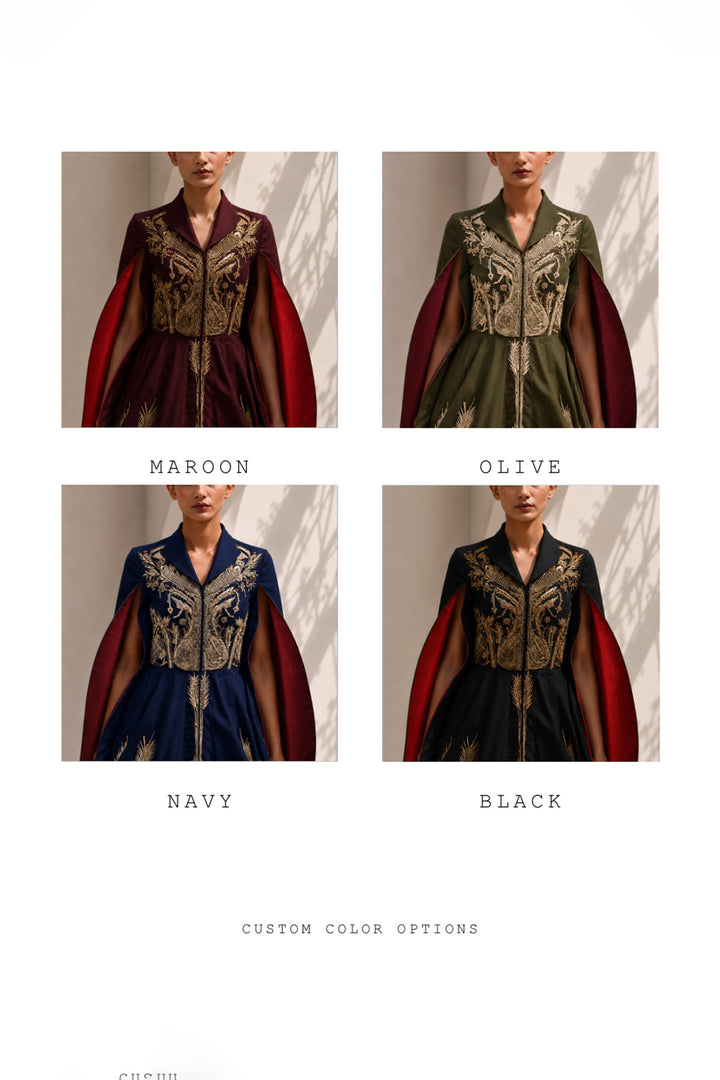 Ivory ensemble featuring intricate gold embroidery, dramatic cape sleeves, and layered volume for a look that is both regal and contemporary.