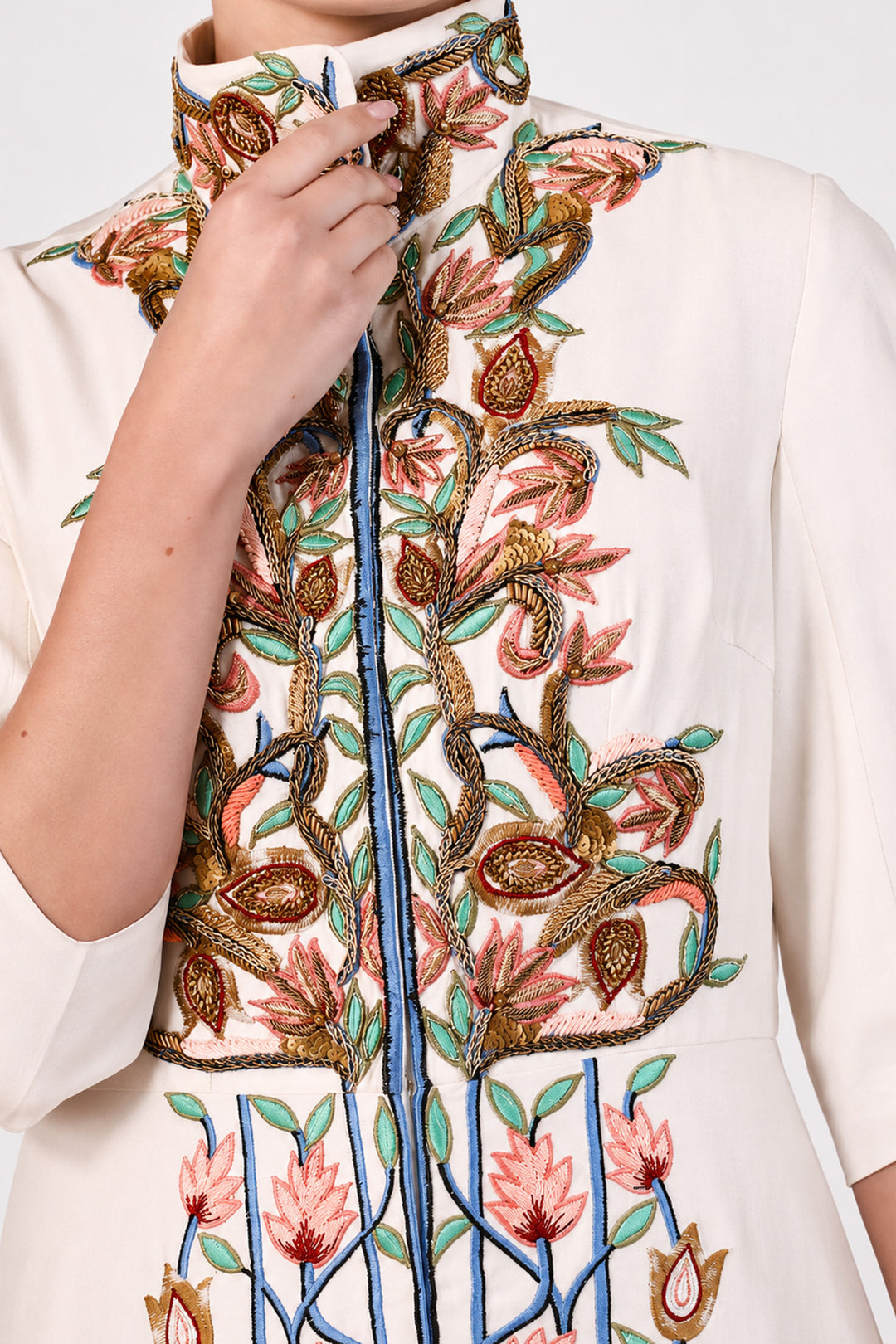 Ivory statement jacket gown adorned with vibrant floral embroidery, elegant high-neck collar detailing and tailored bodice with flatering fit.