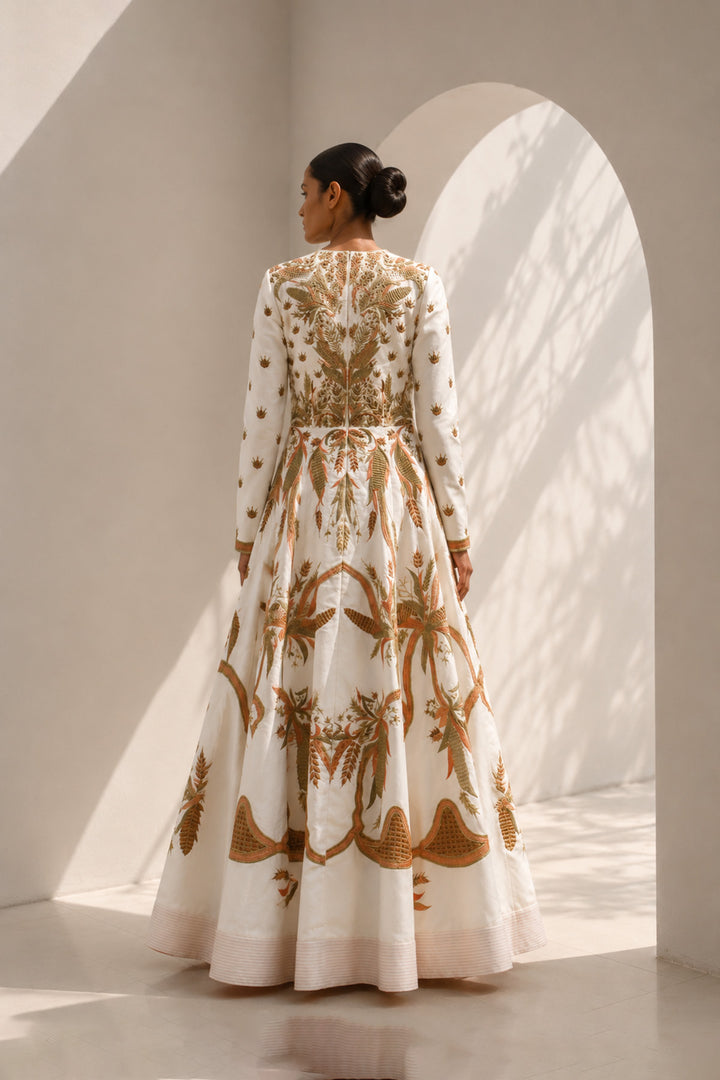 Ivory deep V-neckline embroidered gown with structured bodice, featuring flared silhouettewith graceful volume.