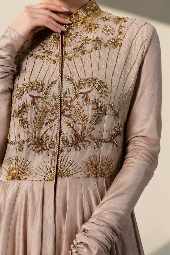 Taupe embroidered Anarkali gown featuring heritage-inspired threadwork, mandarin collar, pintuck detailing on the bodice.