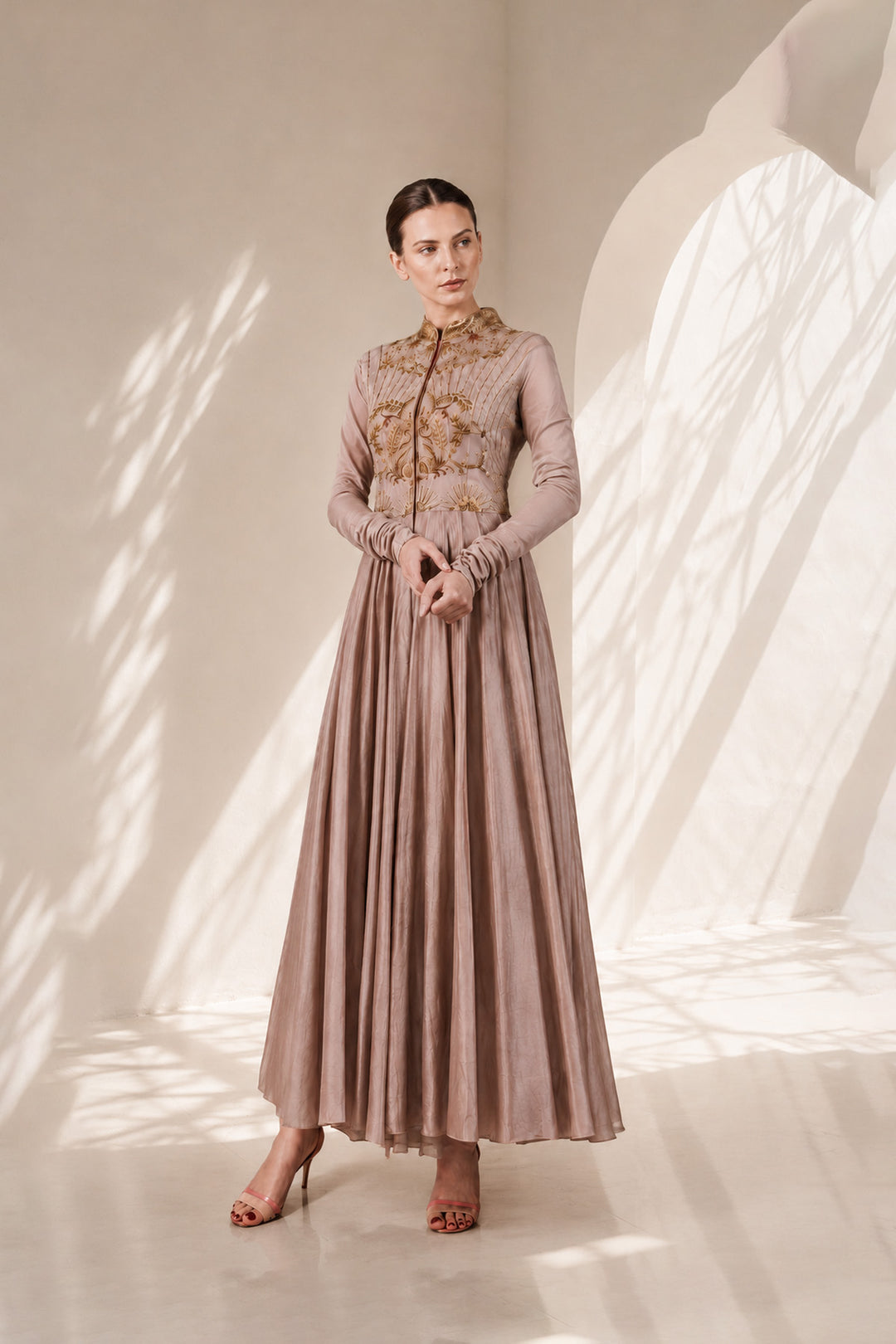 Taupe embroidered Anarkali gown featuring heritage-inspired threadwork, mandarin collar, pintuck detailing on the bodice.
