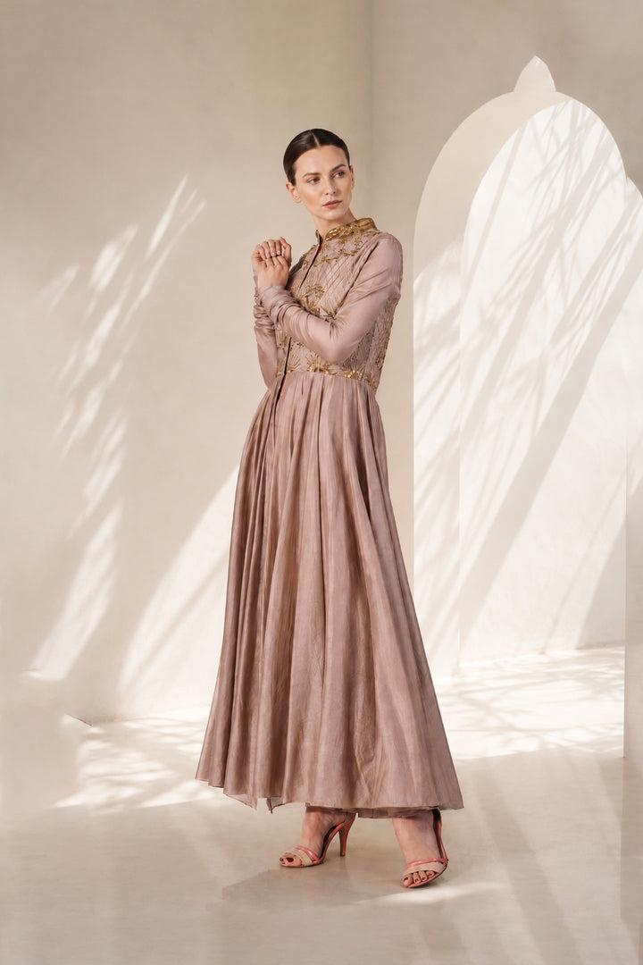 Taupe embroidered Anarkali gown featuring heritage-inspired threadwork, mandarin collar, pintuck detailing on the bodice.