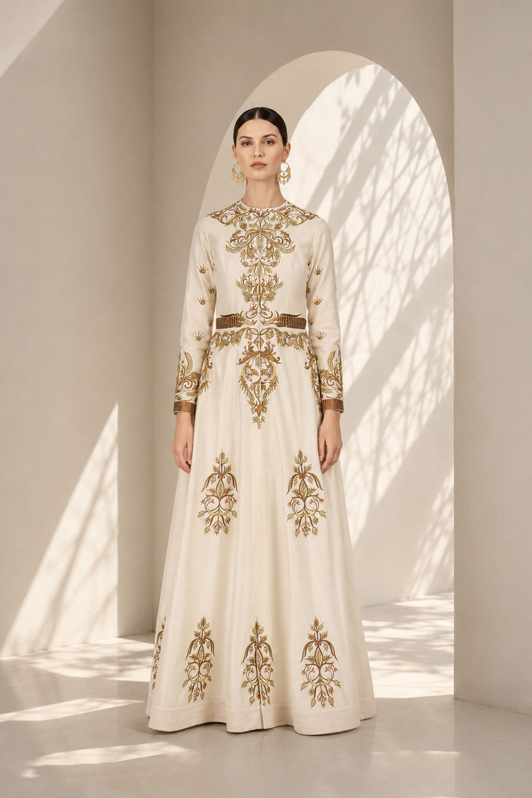Ivory embroidered gown featuring regal placement embroidery, structured bodice and graceful flared silhouette.