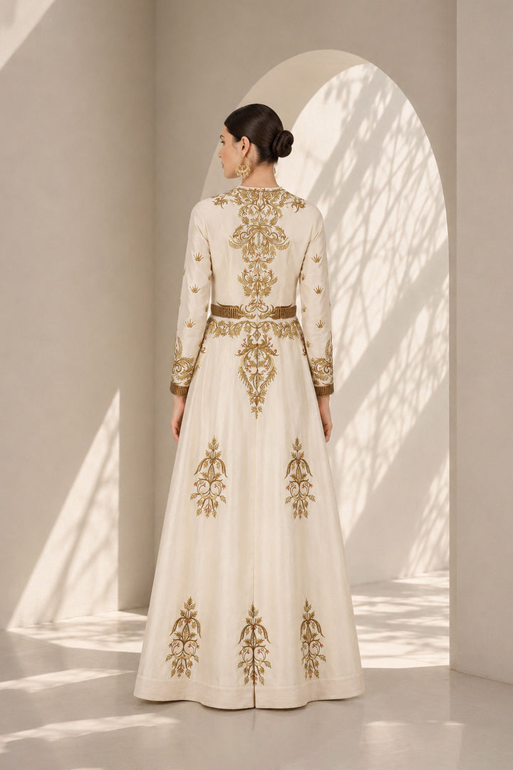 Ivory embroidered gown featuring regal placement embroidery, structured bodice and graceful flared silhouette.