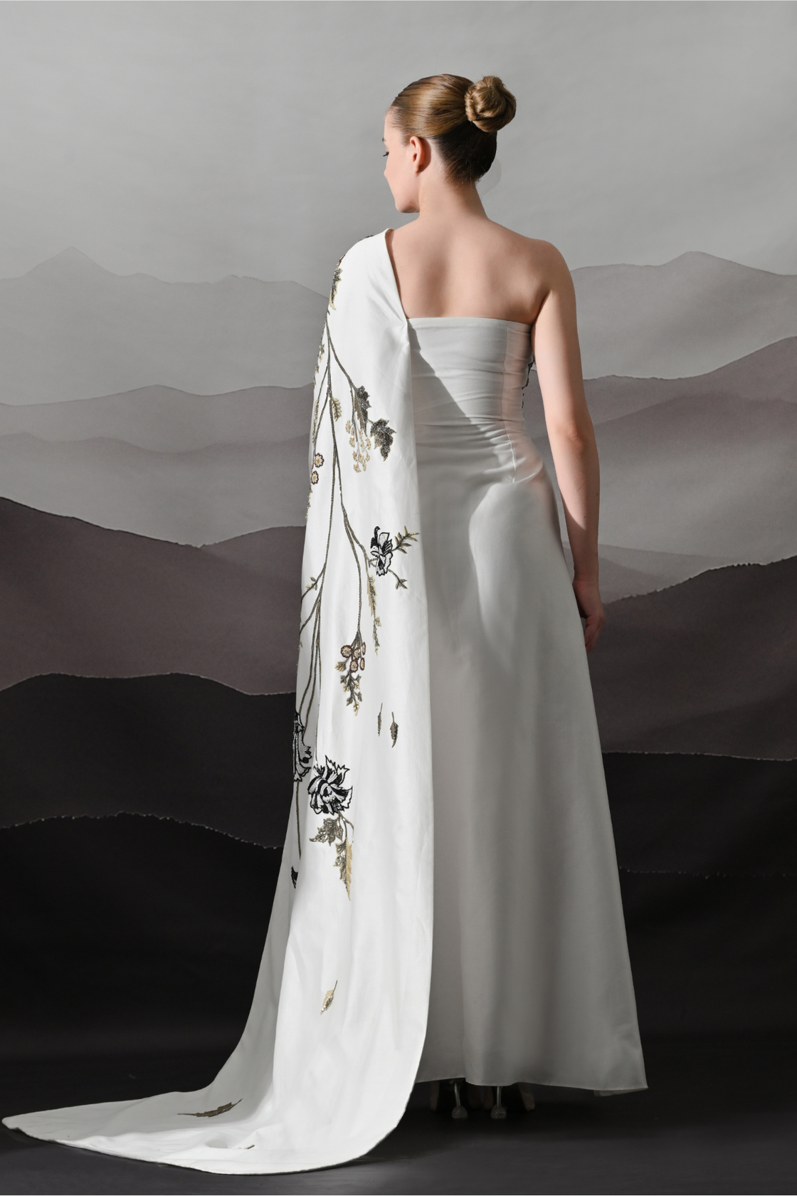 Elegant  Gown Featuring A One-Shoulder Bodice With Embroidered Detailing