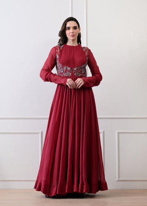 A maroon anarkali with intricate floral embroidery on the bodice