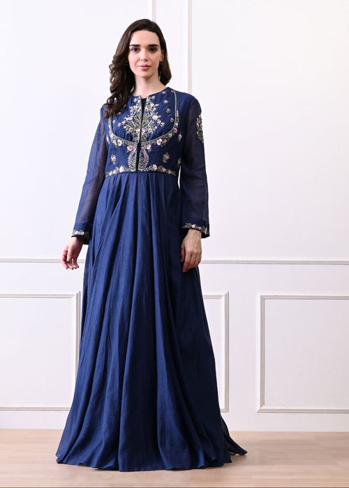 An elegant blue gown with exquisite floral and ornate embroidery