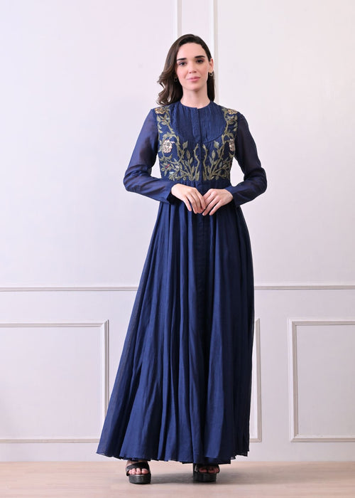 A sophisticated long blue dress showcasing subtle floral embroidery