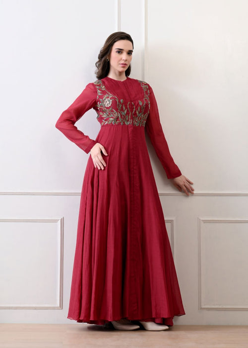 A sophisticated long Maroon dress showcasing subtle floral embroidery