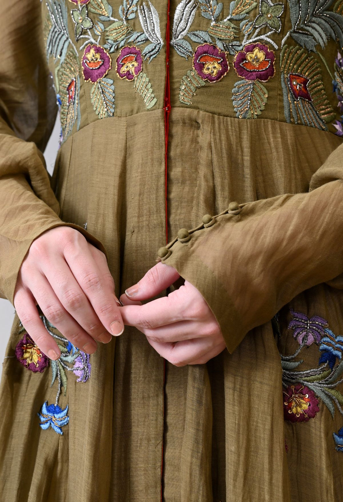 A elegant olive floor-length anarkali-style dress