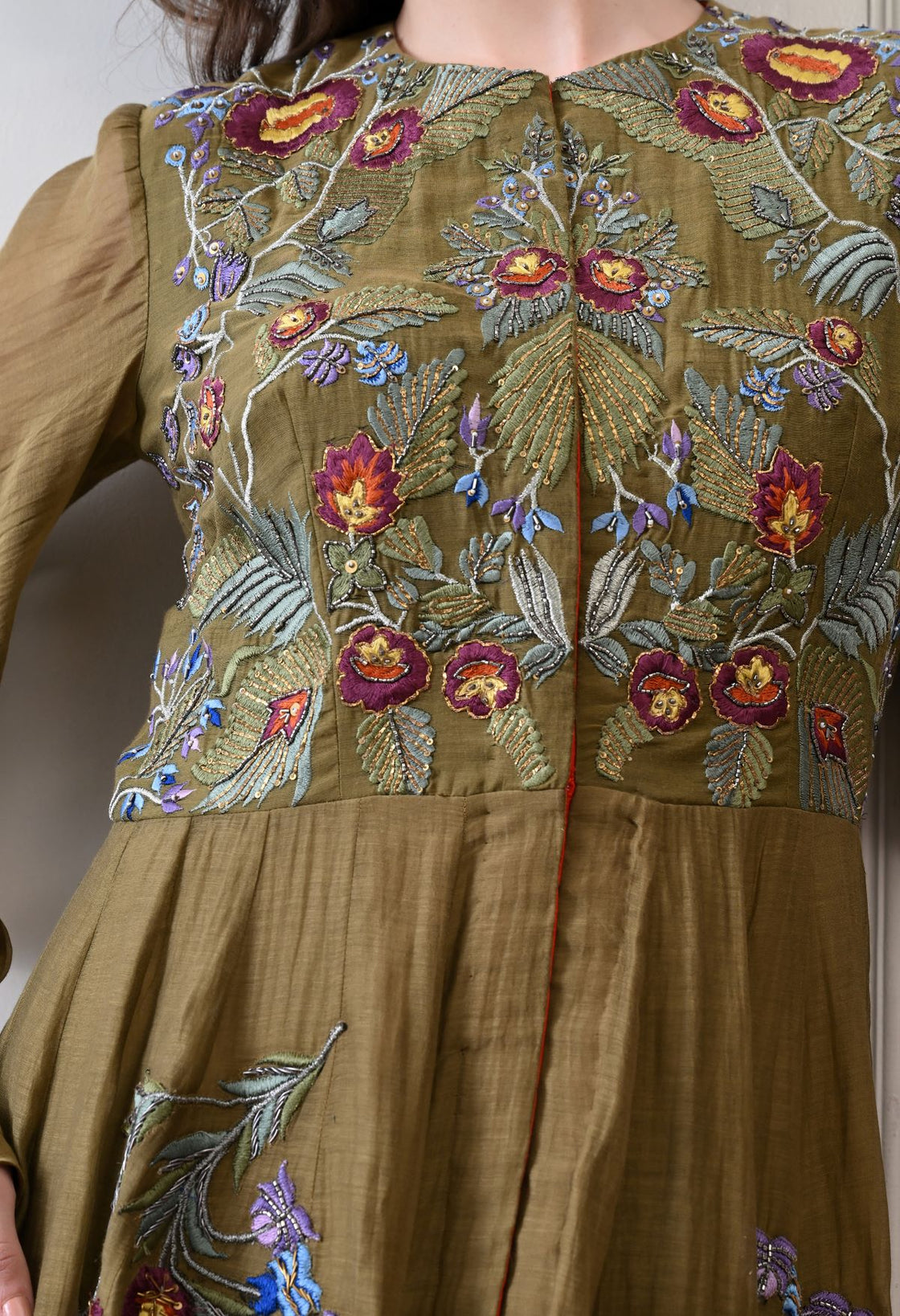 A elegant olive floor-length anarkali-style dress