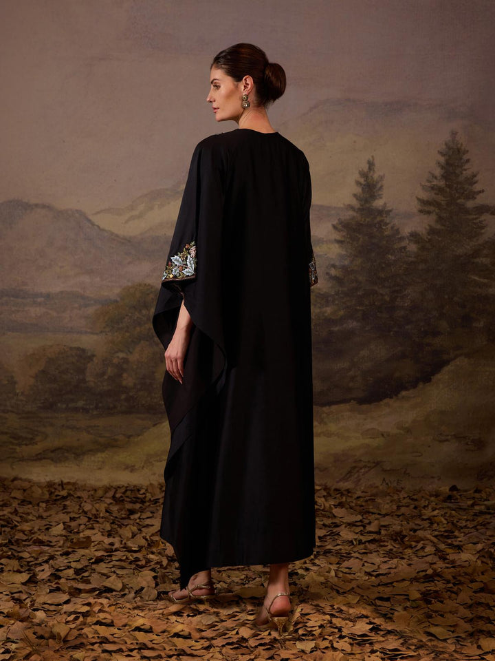 A comfortable yet elegant black caftan-style dress.