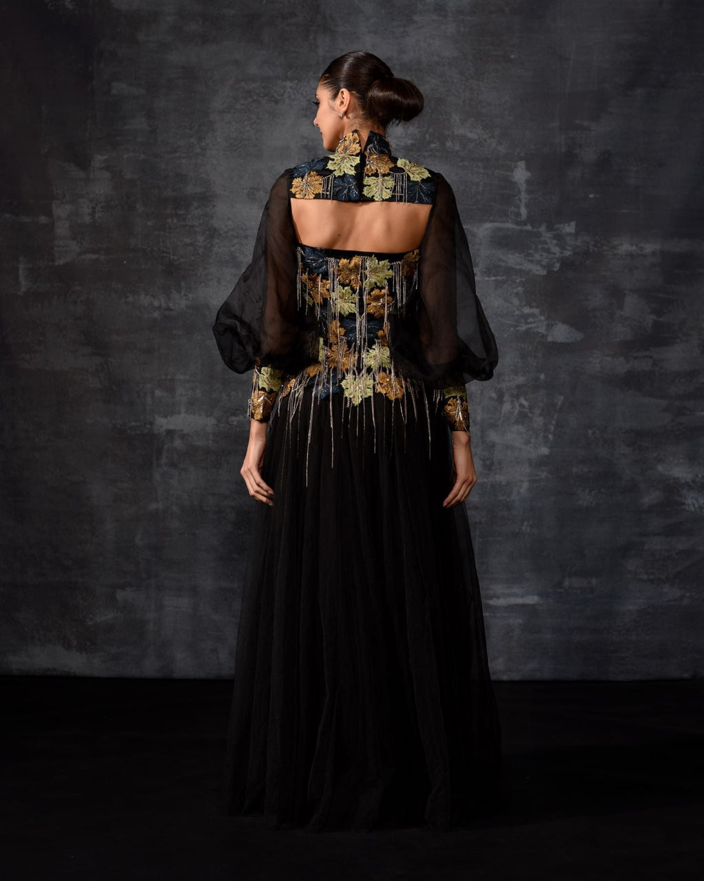 A elegant black off - shoulder gown features a dramatic sleeve top - samantchauhan Apparel & Accessories